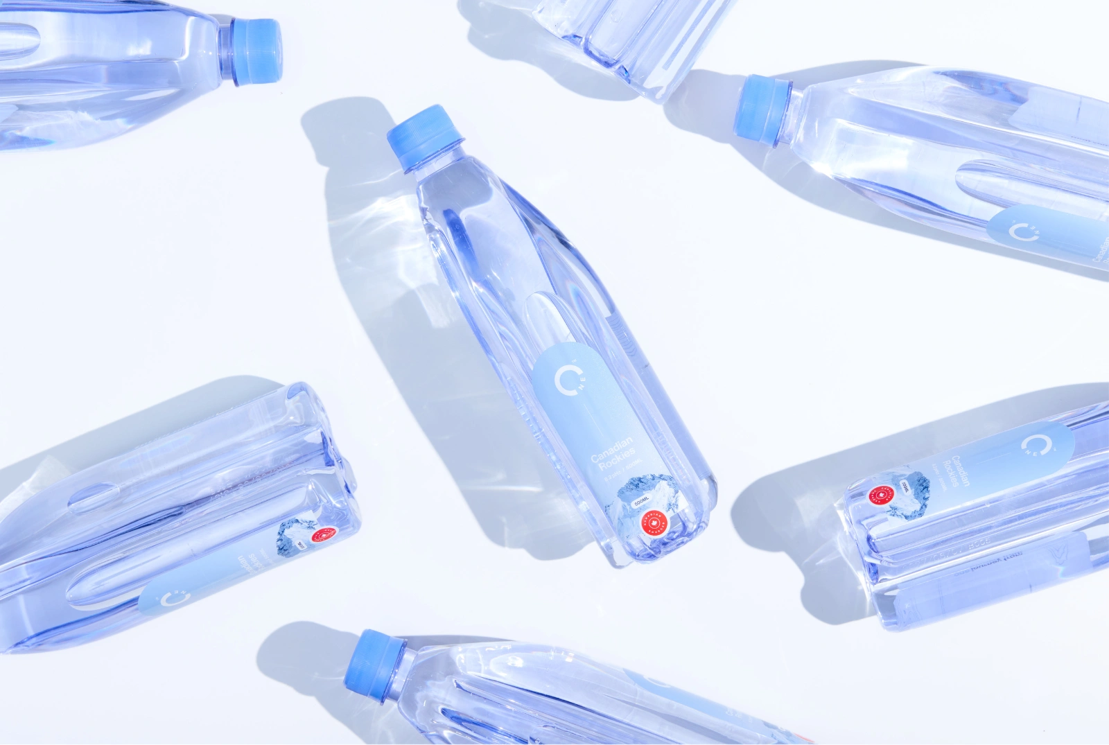 One Water bottles scattered on a white background.